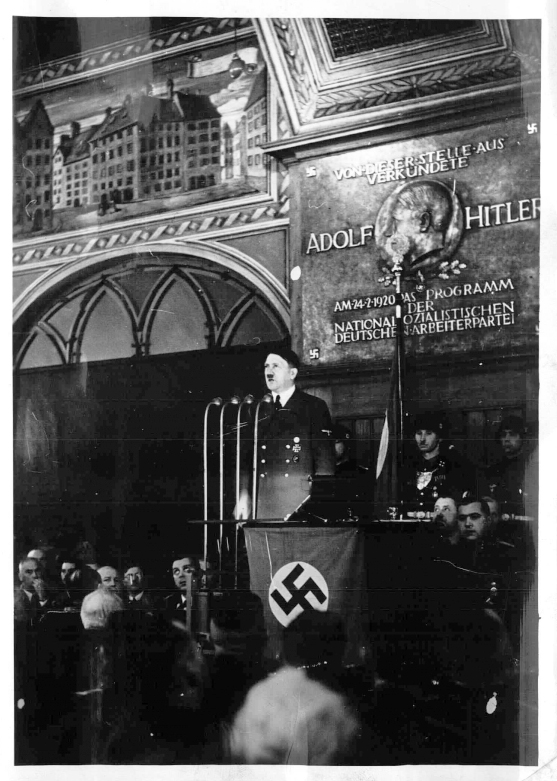 Adolf Hitler making a speech for the Parteigründungsfeier in the Hofbraühaus Munich, with a nice view of the24 2 1920 commemorative plaque